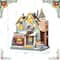 Glitzhome® 10.25" Lighted Christmas Donuts & Coffee Shop Resin Village with Movement and Music